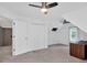 Bedroom with ceiling fans and a view of an office at 2480 Ashbourne Dr, Lawrenceville, GA 30043
