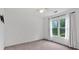 Neutral bedroom with a window dressed with curtains and installed for a television at 2480 Ashbourne Dr, Lawrenceville, GA 30043