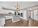 Stylish kitchen with modern lighting, white cabinets, and an island providing ample workspace at 2480 Ashbourne Dr, Lawrenceville, GA 30043