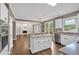 Open kitchen design offers an island, modern appliances, and flows into a spacious living room with a fireplace at 2480 Ashbourne Dr, Lawrenceville, GA 30043