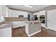 Lovely kitchen with a practical layout featuring an island, stainless steel appliances, and bright white cabinets at 2480 Ashbourne Dr, Lawrenceville, GA 30043