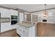 Well-designed kitchen with a large island, built-in oven, and an open layout for entertaining at 2480 Ashbourne Dr, Lawrenceville, GA 30043
