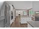Open kitchen with stainless steel appliances and an island that transitions into the adjacent living space at 2480 Ashbourne Dr, Lawrenceville, GA 30043