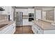 Spacious kitchen features stainless steel appliances, a functional island, and ample countertop space at 2480 Ashbourne Dr, Lawrenceville, GA 30043