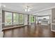 Open-concept living space with hardwood floors, plentiful natural light, and direct access to the modern kitchen at 2480 Ashbourne Dr, Lawrenceville, GA 30043