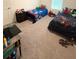 Bright bedroom features twin beds and carpet flooring at 330 Cotton Tail Ln, Villa Rica, GA 30180