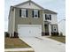 Charming two-story home with a two-car garage and professionally landscaped yard at 330 Cotton Tail Ln, Villa Rica, GA 30180