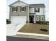 Charming two-story home with a two-car garage and professionally landscaped yard at 330 Cotton Tail Ln, Villa Rica, GA 30180