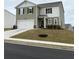 Charming two-story home with a two-car garage and professionally landscaped yard at 330 Cotton Tail Ln, Villa Rica, GA 30180