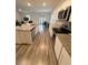 Modern kitchen with granite counters, stainless steel appliances, and a view to the dining area at 330 Cotton Tail Ln, Villa Rica, GA 30180