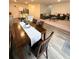 Open-concept living space with dining room and kitchen. The space features plenty of natural light at 330 Cotton Tail Ln, Villa Rica, GA 30180