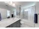 Well-lit bathroom featuring modern fixtures, a shower-tub combo, and a sleek vanity at 4960 Shade Creek Xing, Cumming, GA 30028