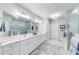 Luxurious bathroom with double vanity, marble countertops, and a walk-in shower with glass enclosure at 4960 Shade Creek Xing, Cumming, GA 30028