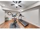 Spacious basement exercise room with laminate flooring, exercise equipment, and neutral paint at 4960 Shade Creek Xing, Cumming, GA 30028