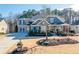 Charming two-story home with a welcoming front porch and well-maintained landscaping at 4960 Shade Creek Xing, Cumming, GA 30028