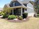 Charming two-story home with a covered front porch and lovely landscaping at 4960 Shade Creek Xing, Cumming, GA 30028