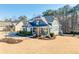 Stunning two-story house showcasing manicured landscaping and a charming porch at 4960 Shade Creek Xing, Cumming, GA 30028