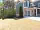 The exterior view of the property features a brick-and-siding garage and fenced-in lawn at 4960 Shade Creek Xing, Cumming, GA 30028