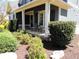Inviting covered front porch with cozy seating and decorative accents at 4960 Shade Creek Xing, Cumming, GA 30028