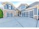Spacious three-car garage with ample parking space and stylish doors at 4960 Shade Creek Xing, Cumming, GA 30028