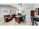 Cozy home office with a leather chair, multiple desks, and organized storage solutions at 4960 Shade Creek Xing, Cumming, GA 30028