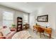 Stylish home office with a cozy chair, desk, and ample storage space at 4960 Shade Creek Xing, Cumming, GA 30028