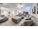 Spacious living room with a large sectional sofa, upstairs access and a comfortable beanbag chair at 4960 Shade Creek Xing, Cumming, GA 30028