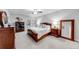 Spacious bedroom with neutral walls, carpet floors, ceiling fan and furniture at 4960 Shade Creek Xing, Cumming, GA 30028