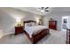Beautiful primary bedroom featuring neutral carpet, paint, and ceiling fan at 4960 Shade Creek Xing, Cumming, GA 30028