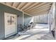 Enjoy outdoor living on this covered patio, featuring neutral decor and space for dining and relaxation at 4960 Shade Creek Xing, Cumming, GA 30028