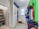 Bright walk-in closet with shelves and rods, providing ample storage space for clothes and accessories at 4960 Shade Creek Xing, Cumming, GA 30028