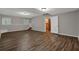Finished basement featuring wood-look floors, two windows, and an open floor plan at 5309 Ashley Se Dr, Conyers, GA 30094