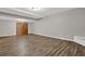 Spacious basement features wood-look floors and neutral walls, offering a versatile living space at 5309 Ashley Se Dr, Conyers, GA 30094