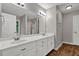 Bathroom features a double vanity and a large mirror at 5309 Ashley Se Dr, Conyers, GA 30094