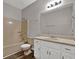 This bathroom features a bathtub and shower combination with a single sink vanity at 5309 Ashley Se Dr, Conyers, GA 30094