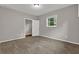 Bedroom featuring neutral walls, carpet, and natural light at 5309 Ashley Se Dr, Conyers, GA 30094