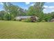 Well-maintained home with lush lawn and mature trees in a tranquil setting at 5309 Ashley Se Dr, Conyers, GA 30094