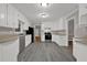 Well-lit kitchen with stainless steel appliances, ample counter space, and grey floors at 5309 Ashley Se Dr, Conyers, GA 30094