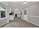 Bright kitchen features white cabinets, modern appliances, and hardwood floors at 5309 Ashley Se Dr, Conyers, GA 30094