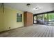 Enclosed back porch with brick column and view of wooded backyard at 5309 Ashley Se Dr, Conyers, GA 30094