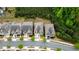 Aerial view of a neighborhood showcasing well-maintained homes, mature trees, and landscaping at 6265 Bellmoore Park Ln, Johns Creek, GA 30097