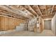 Unfinished basement displays the framework including the ceiling with insulation, and concrete slab at 6265 Bellmoore Park Ln, Johns Creek, GA 30097