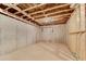 Unfinished basement with concrete foundation, and exposed ceiling with hanging water pipe at 6265 Bellmoore Park Ln, Johns Creek, GA 30097