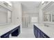 Elegant bathroom featuring double vanities, soaking tub, and separate glass shower at 6265 Bellmoore Park Ln, Johns Creek, GA 30097