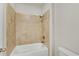 This bathroom features a tub-shower combination with tile surround at 6265 Bellmoore Park Ln, Johns Creek, GA 30097