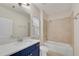 This bathroom features a single sink vanity and a tub-shower combination at 6265 Bellmoore Park Ln, Johns Creek, GA 30097