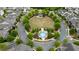 Aerial view of green space and gazebo within a circle of houses and landscaping at 6265 Bellmoore Park Ln, Johns Creek, GA 30097