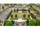 Aerial view of community clubhouse with a lawn, trees, and landscaped gardens at 6265 Bellmoore Park Ln, Johns Creek, GA 30097