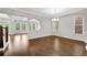 Spacious dining room with hardwood floors, natural light, and modern design, perfect for gatherings at 6265 Bellmoore Park Ln, Johns Creek, GA 30097
