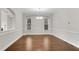 Bright dining room with hardwood floors and modern chandelier, great for intimate gatherings at 6265 Bellmoore Park Ln, Johns Creek, GA 30097